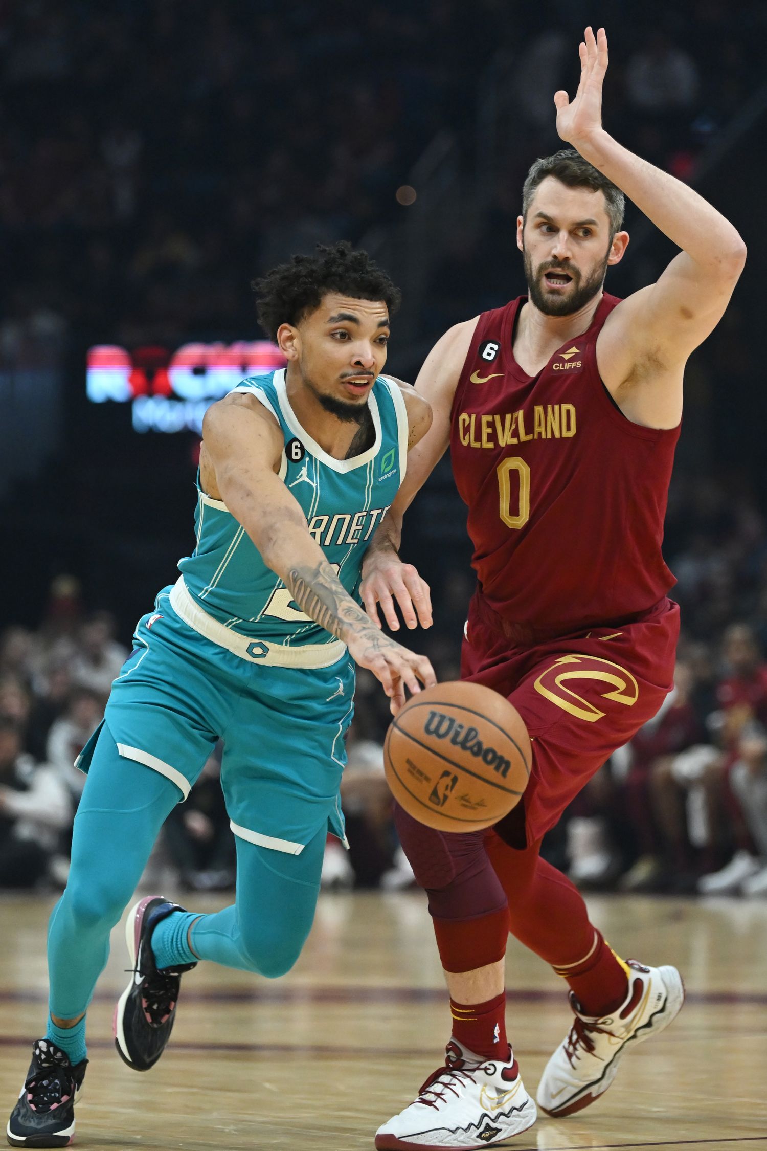 Charlotte Hornets guard James Bouknight (2) drives to the basket against Cleveland Cavaliers forward Kevin Love (0) during the first half at Rocket Mortgage FieldHouse.